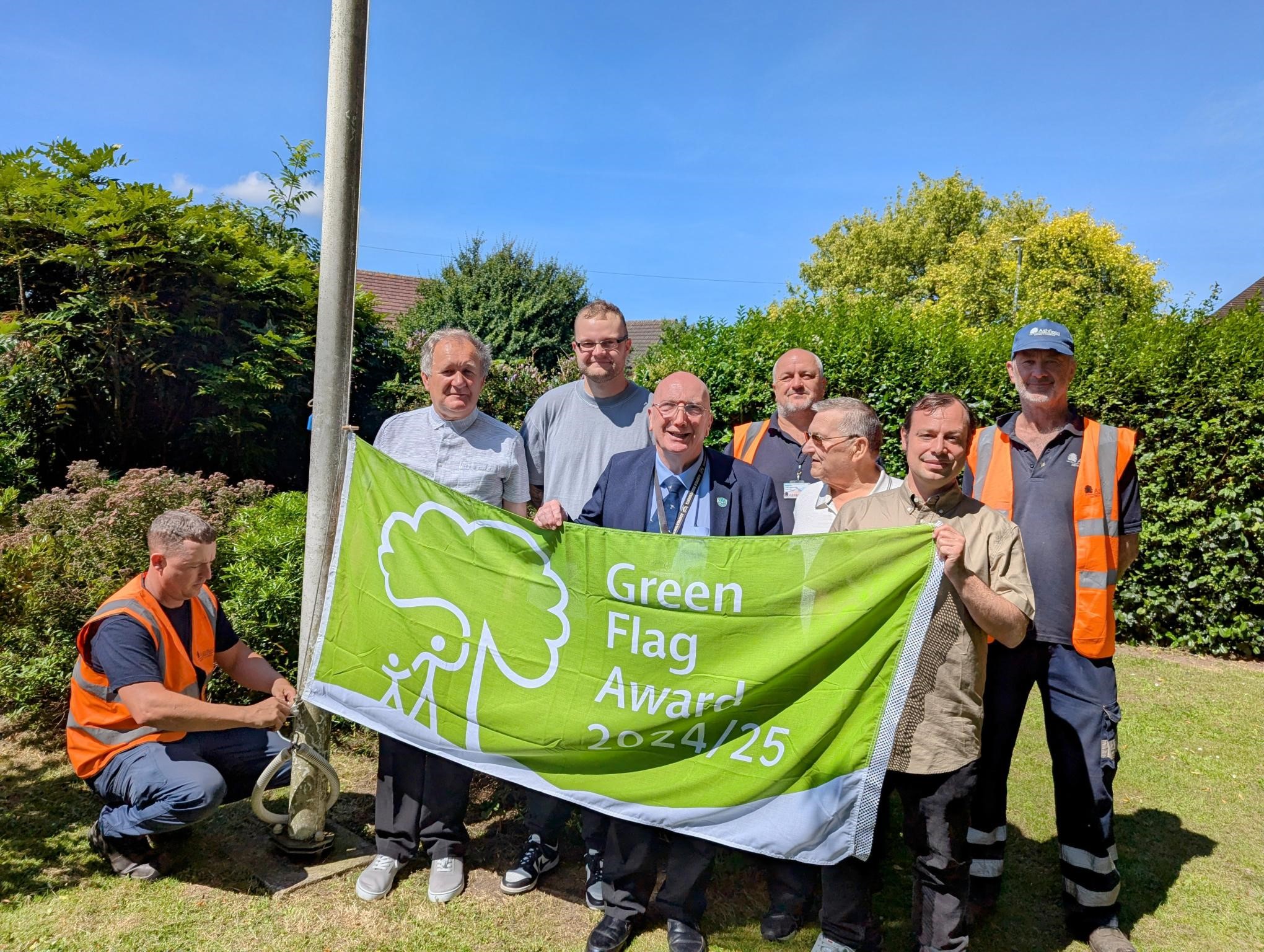 Members of Titchfield park staff holding the Green flag for 2024/2025