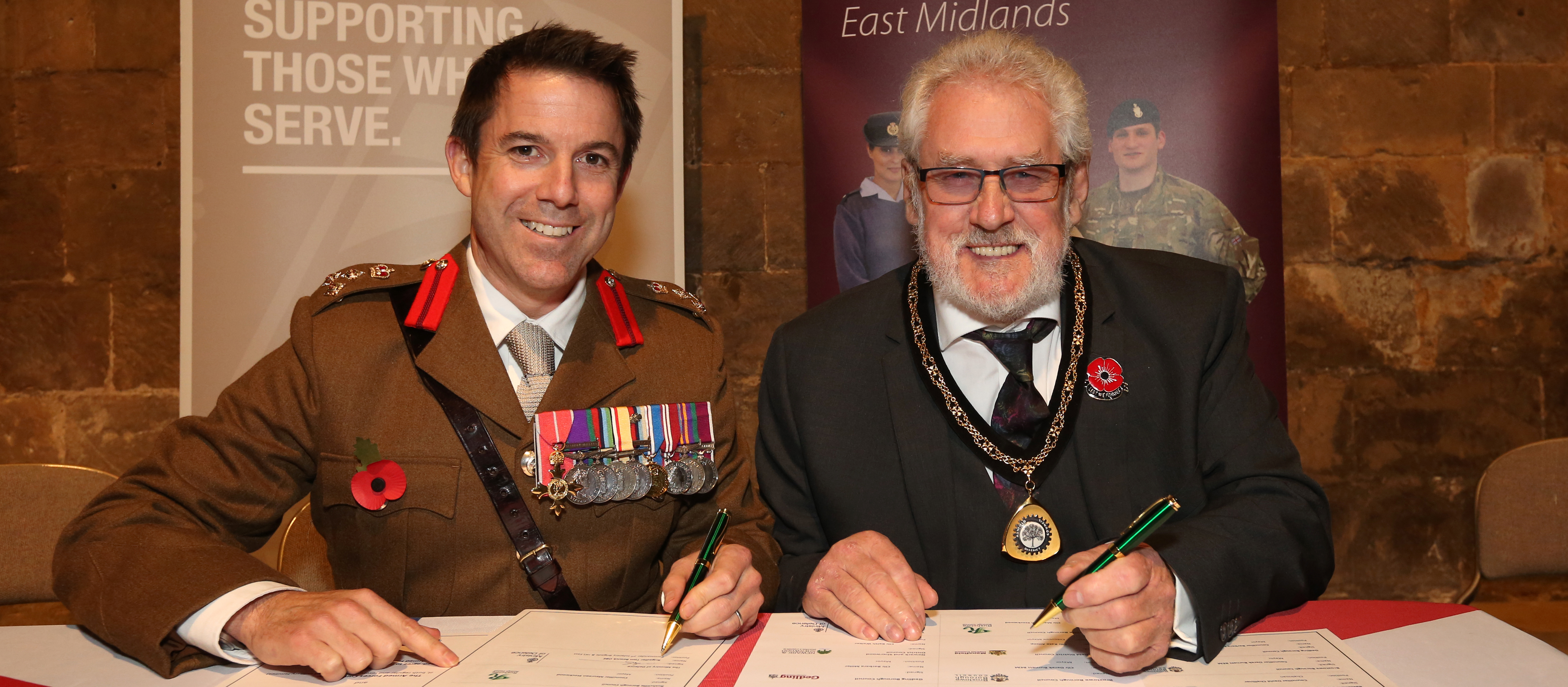 Brigadier Tom Bewick OBE and Vice-Chairman Cllr Anthony Brewer signing the Armed Forces Covenant