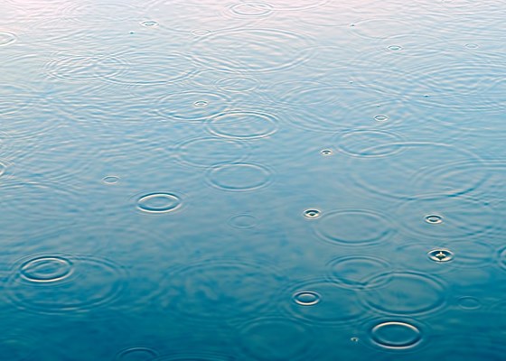 Raindrops on water