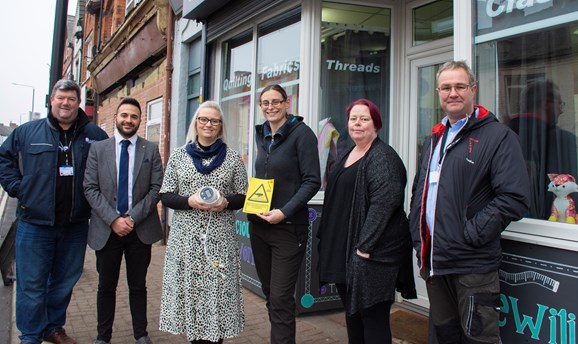 Cllr's and  Ashfield Council officers with new safer streets CCTV camera outside shop 