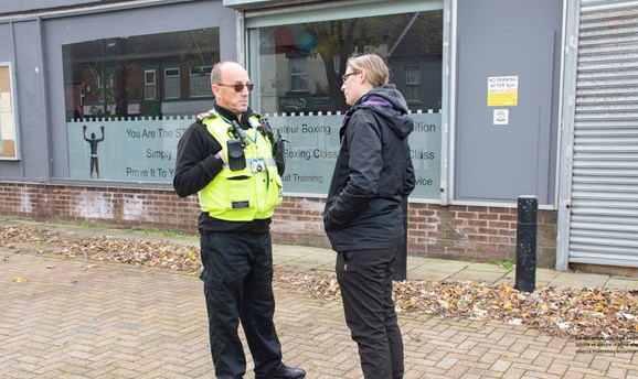 Cllr Helen Ann Smith with an Anti-Social Behaviour Officer in front of business 