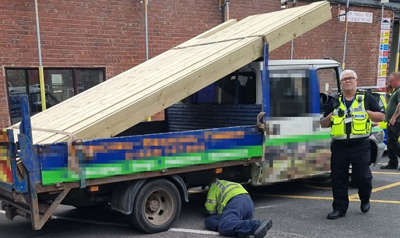 Police stop commercial vehicle to perform weight prohibition inspection
