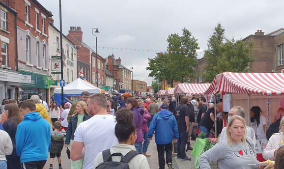 crowds of people looking at stalls on Hucknall High street 